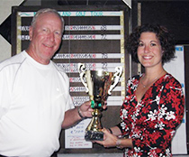 Emily Haining from Polar Beverages proudly presents the Polar Cup to 2009 points winner, Mark Larocco.